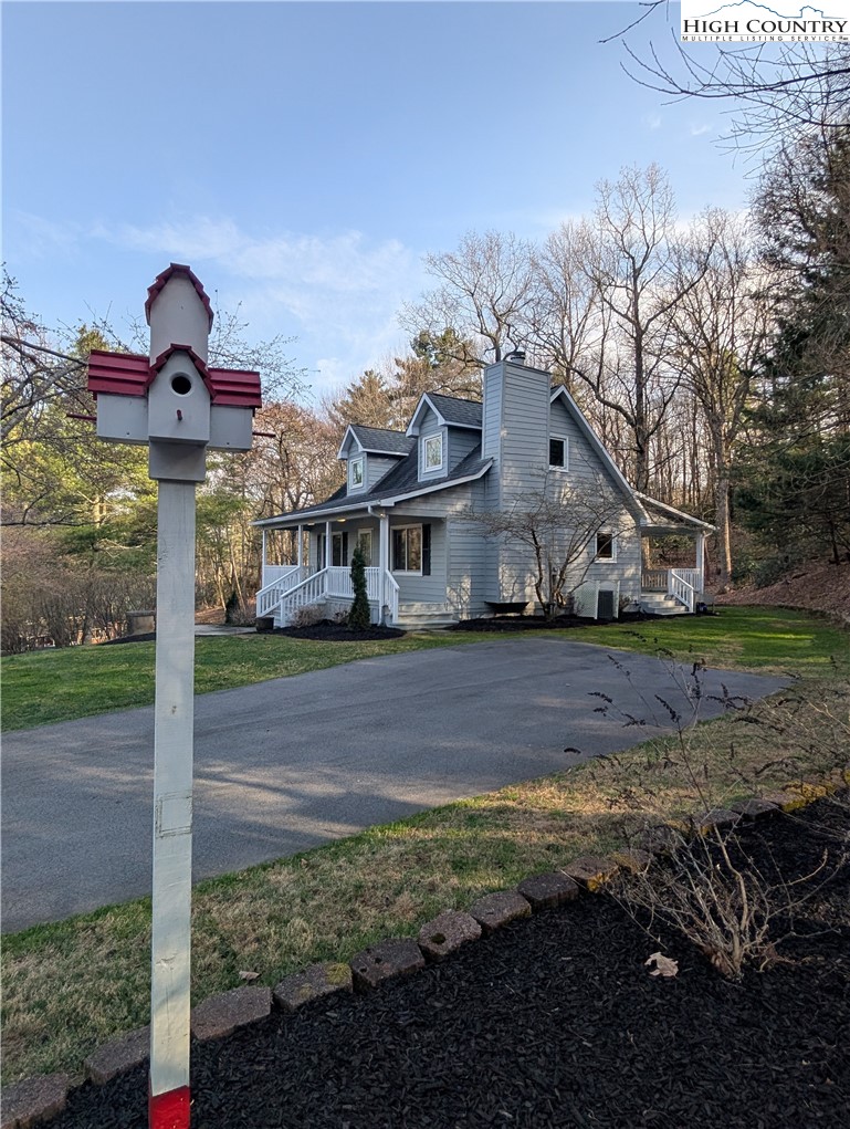 57 Village Road Glade Valley, NC 28627 - Photo 43 of 47 a front view of a house with a yard