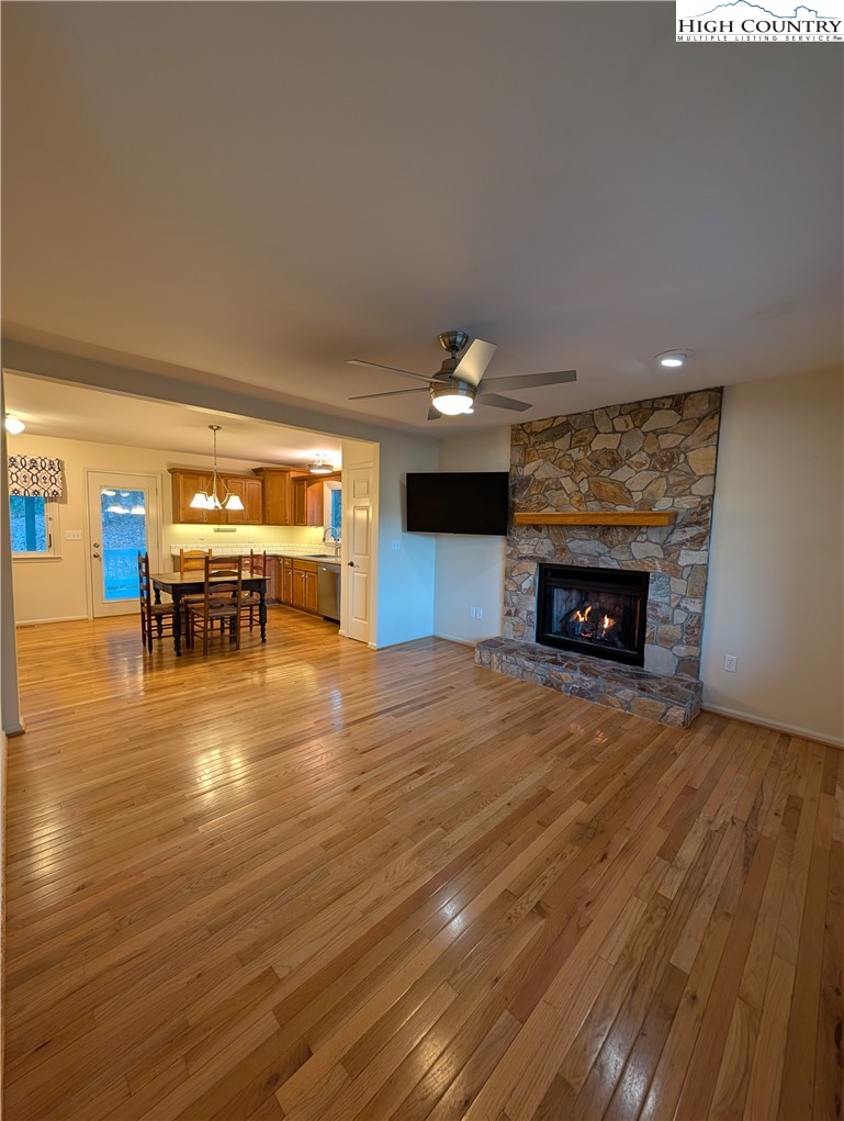 57 Village Road Glade Valley, NC 28627 - Photo 46 of 47 a room with wooden floor and fireplace