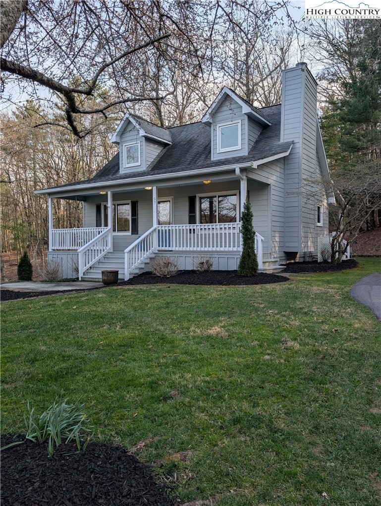 57 Village Road Glade Valley, NC 28627 - Photo 47 of 47 a front view of house with yard and green space