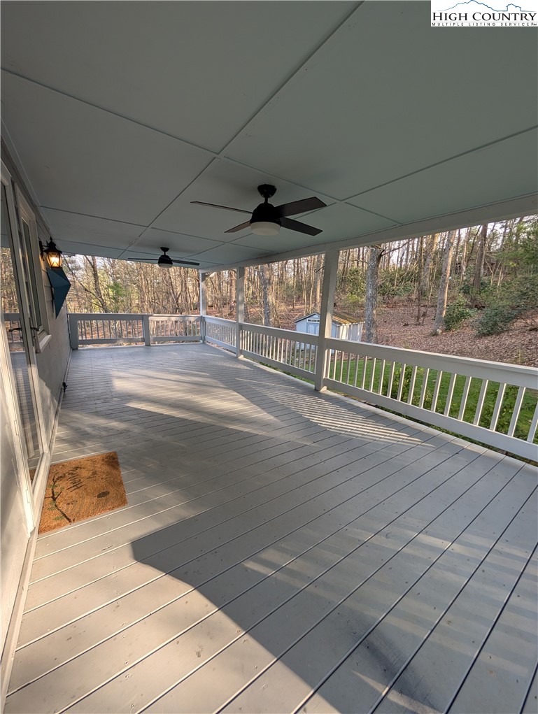 57 Village Road Glade Valley, NC 28627 - Photo 10 of 47 a view of an empty room with a floor to ceiling window
