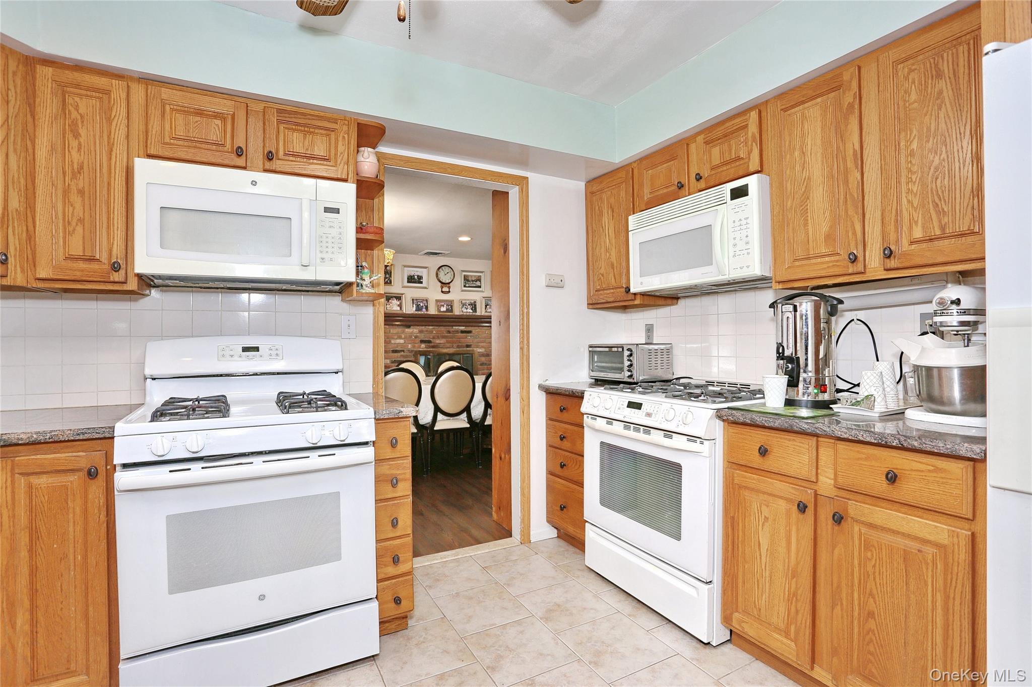 277 Saddle River Road Airmont, NY 10952 - Photo 14 of 25 a kitchen with cabinets stainless steel appliances and a sink