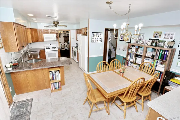 a view of kitchen and dining area with furniture