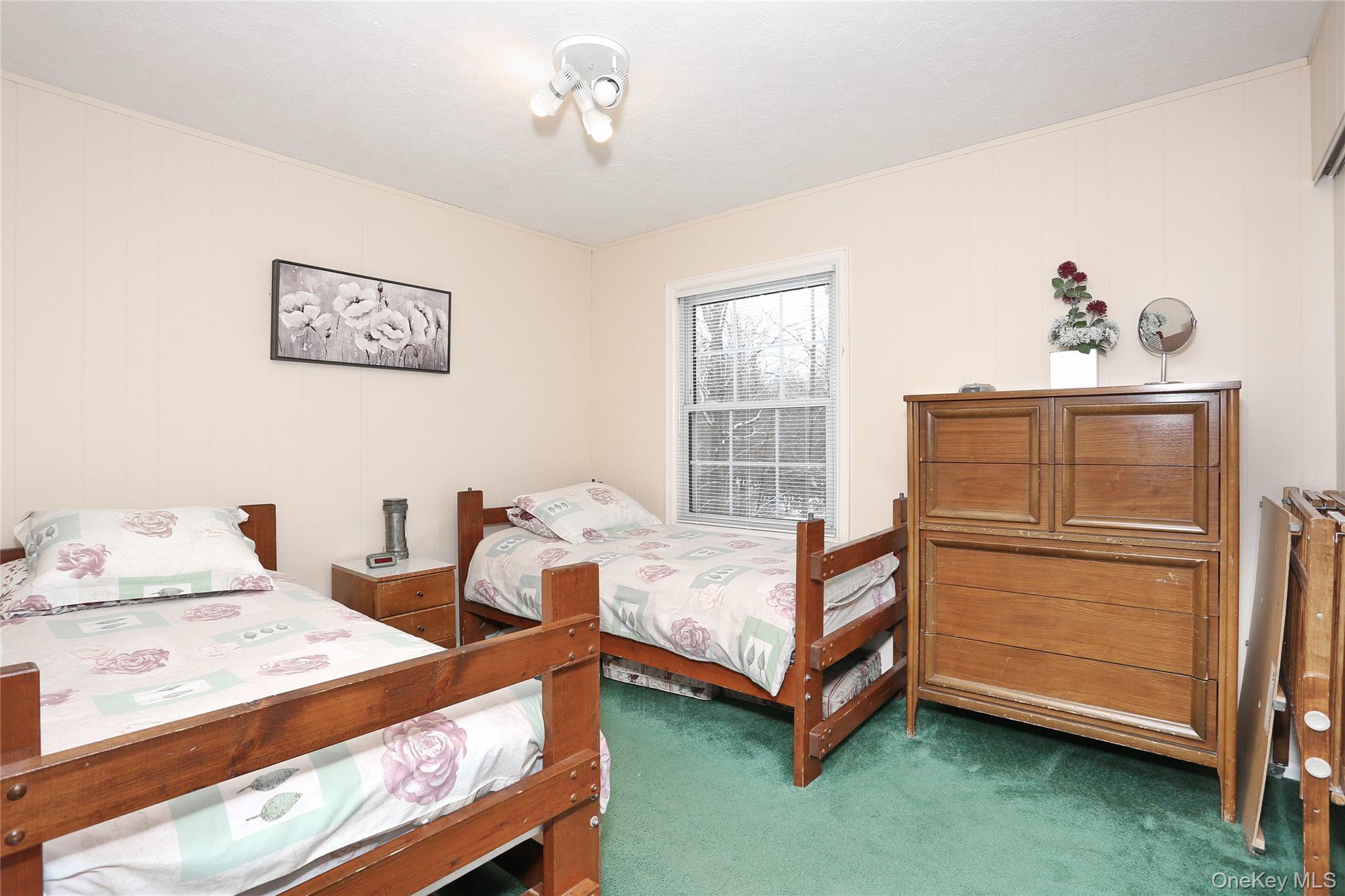 277 Saddle River Road Airmont, NY 10952 - Photo 23 of 25 a bedroom with a bed and a window