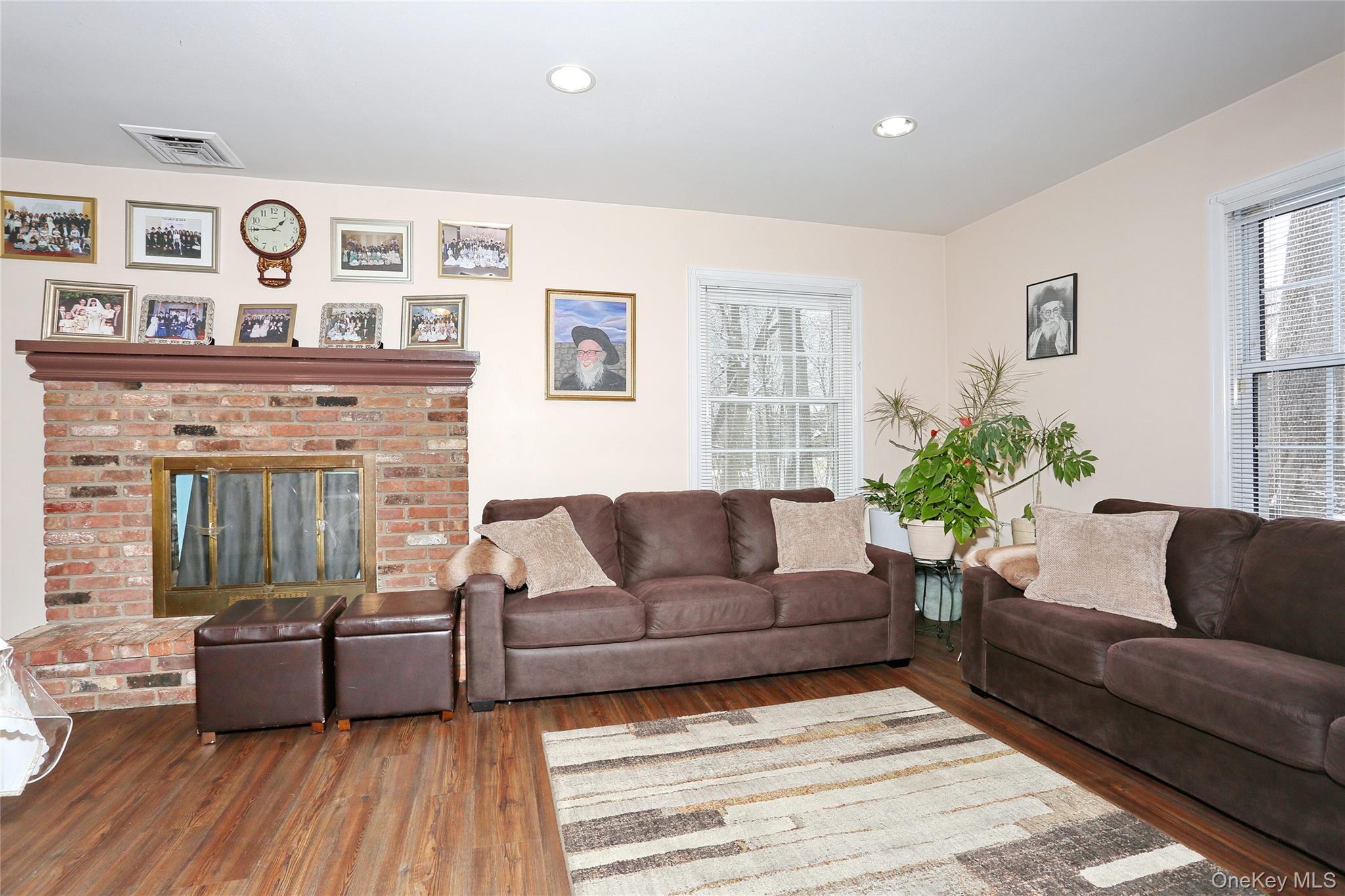277 Saddle River Road Airmont, NY 10952 - Photo 7 of 25 a living room with furniture and wooden floor