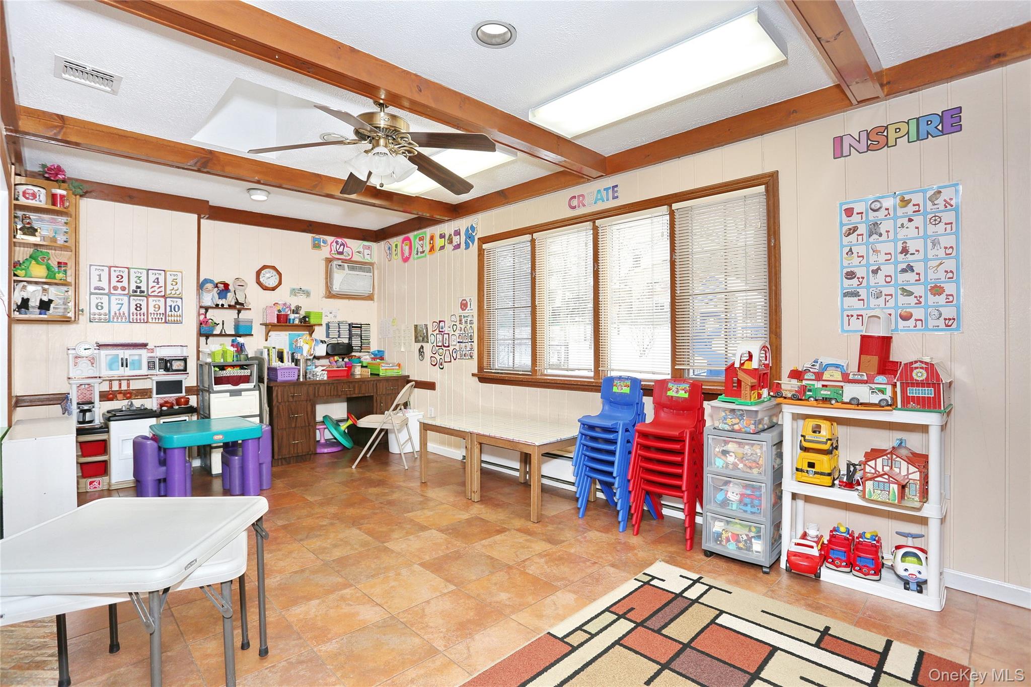 277 Saddle River Road Airmont, NY 10952 - Photo 10 of 25 a reading room with furniture and a rug