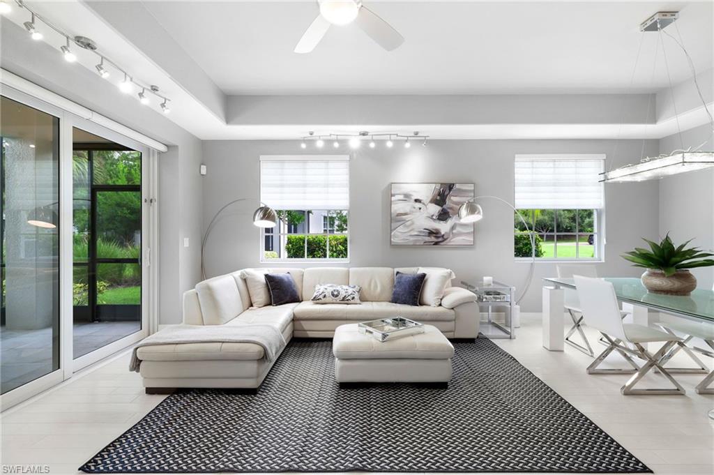 a living room with furniture and a rug