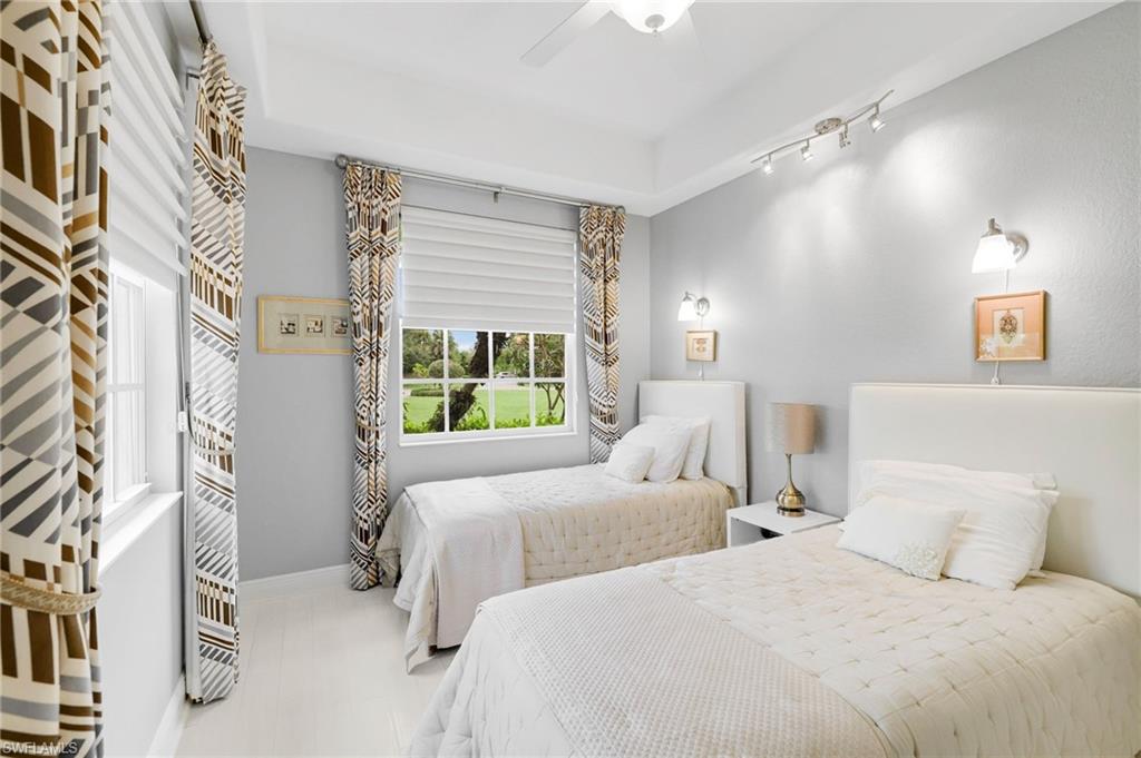 19670 Marino Lake Circle, Unit 2502 Miromar Lakes, FL 33913 - Photo 13 of 40 a bedroom with two beds and a window