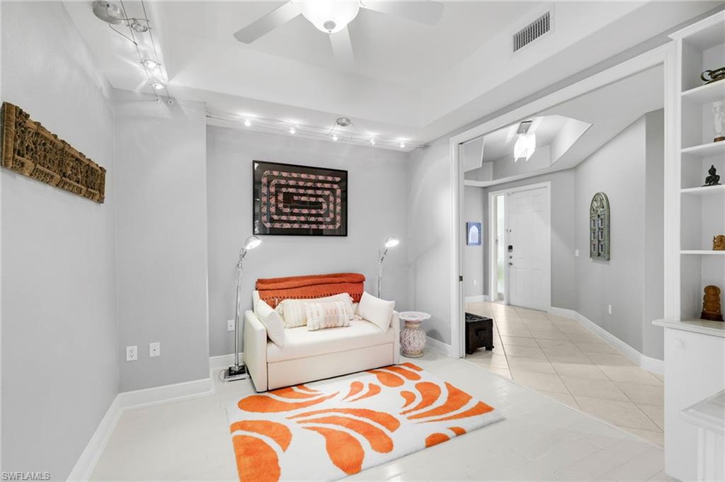 19670 Marino Lake Circle, Unit 2502 Miromar Lakes, FL 33913 - Photo 14 of 40 a bedroom with a bed and a couch