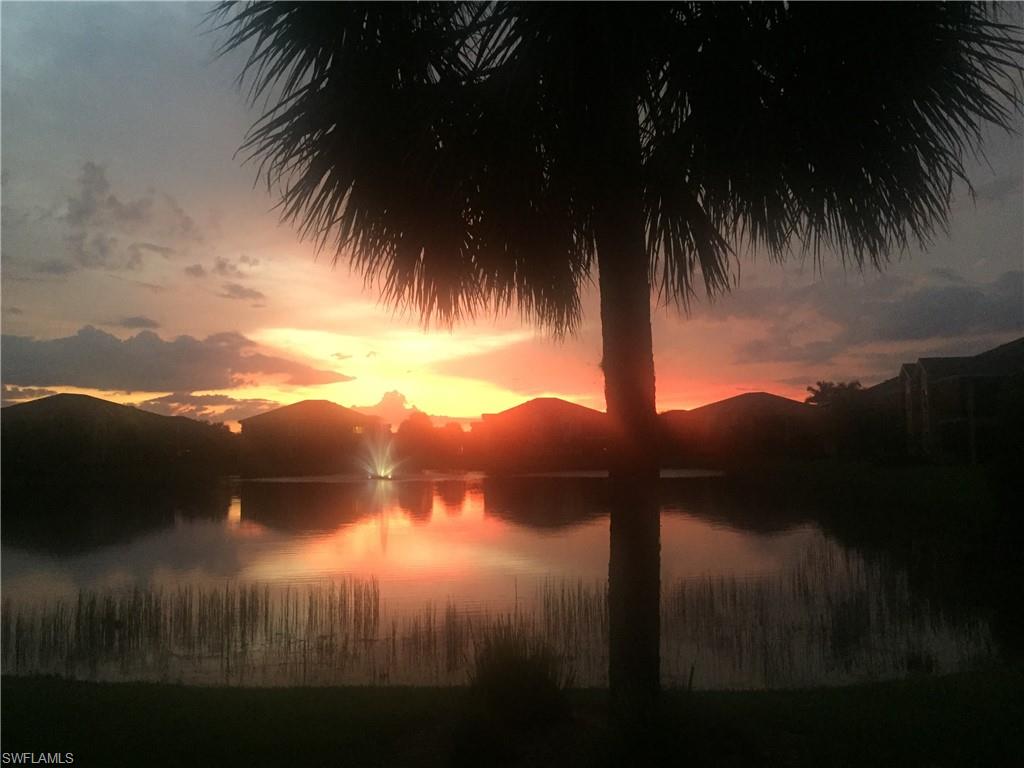 19670 Marino Lake Circle, Unit 2502 Miromar Lakes, FL 33913 - Photo 18 of 40 a sunset view with swimming pool