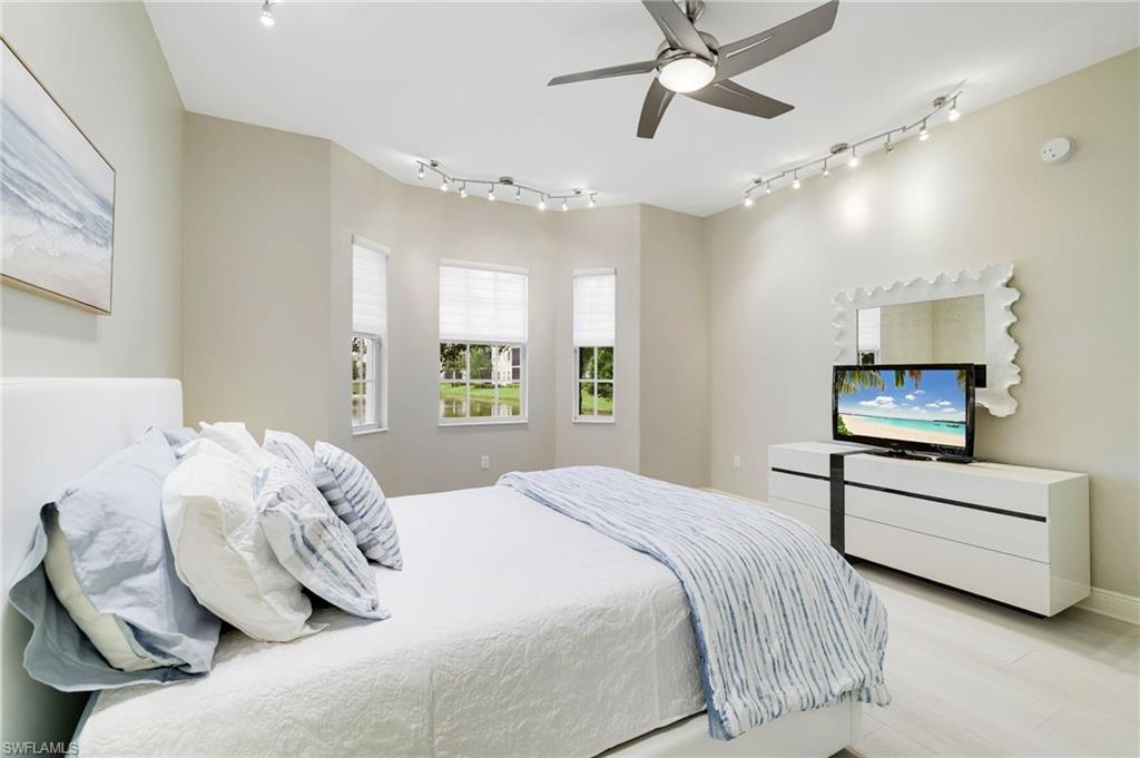 19670 Marino Lake Circle, Unit 2502 Miromar Lakes, FL 33913 - Photo 6 of 40 a bedroom with a bed and window