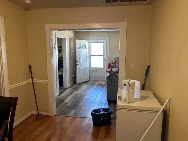 a view of kitchen and wooden floor