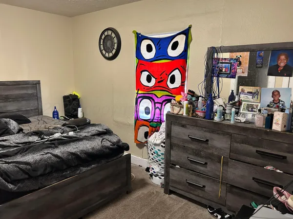 a bedroom with a bed and furniture