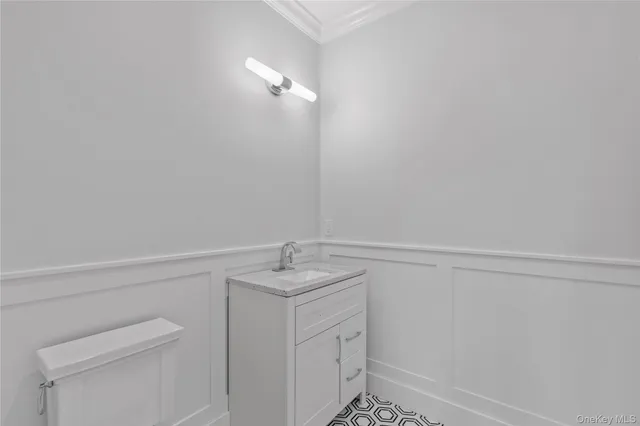 a bathroom with a sink and vanity