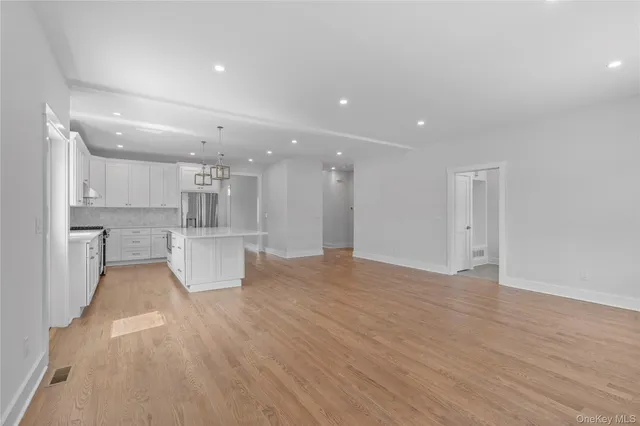 a view of kitchen with wooden floor and windows