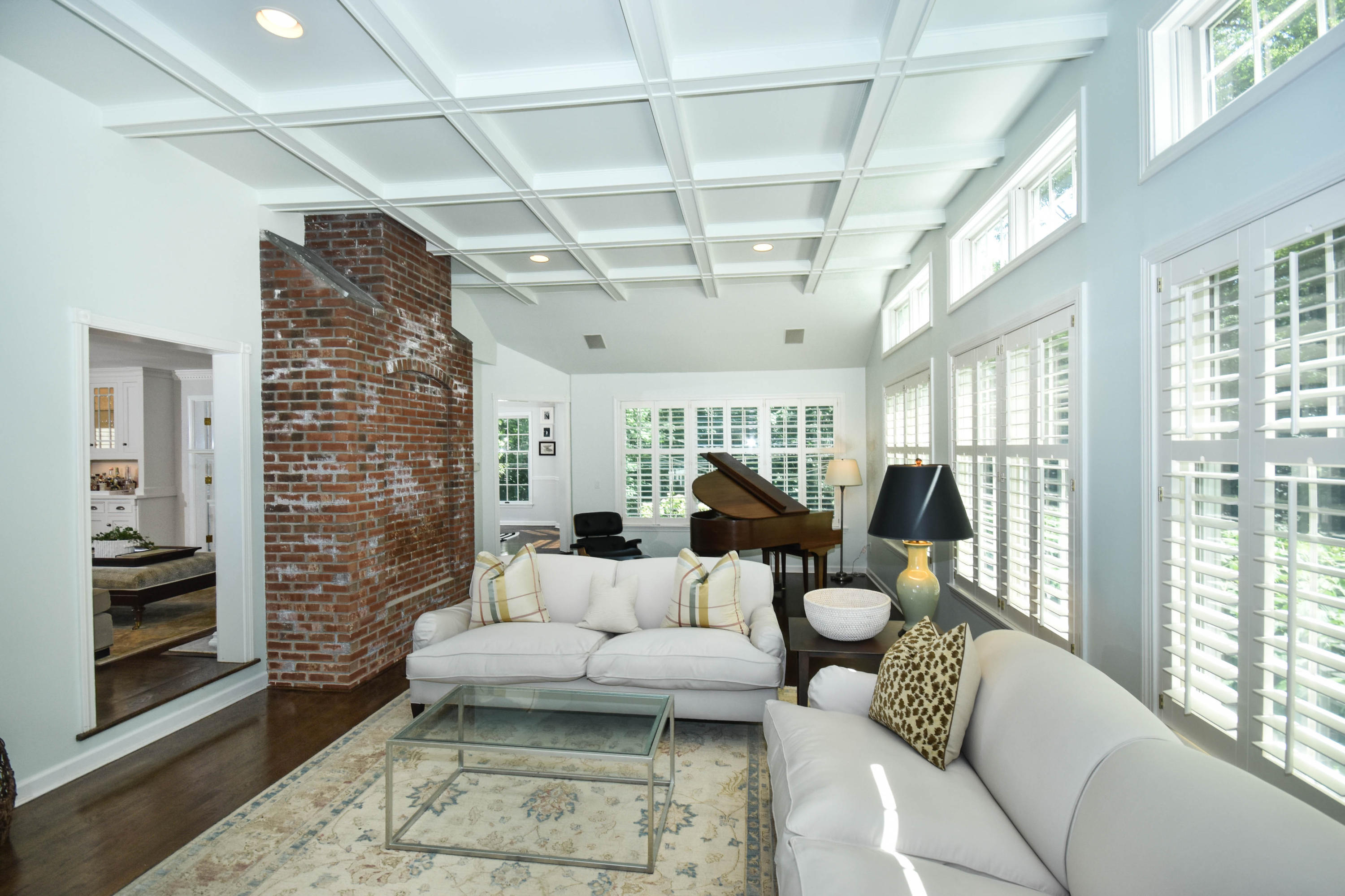104 Jonathan Road New Canaan, CT 06840 - Photo 12 of 25 a living room with furniture and a floor to ceiling window