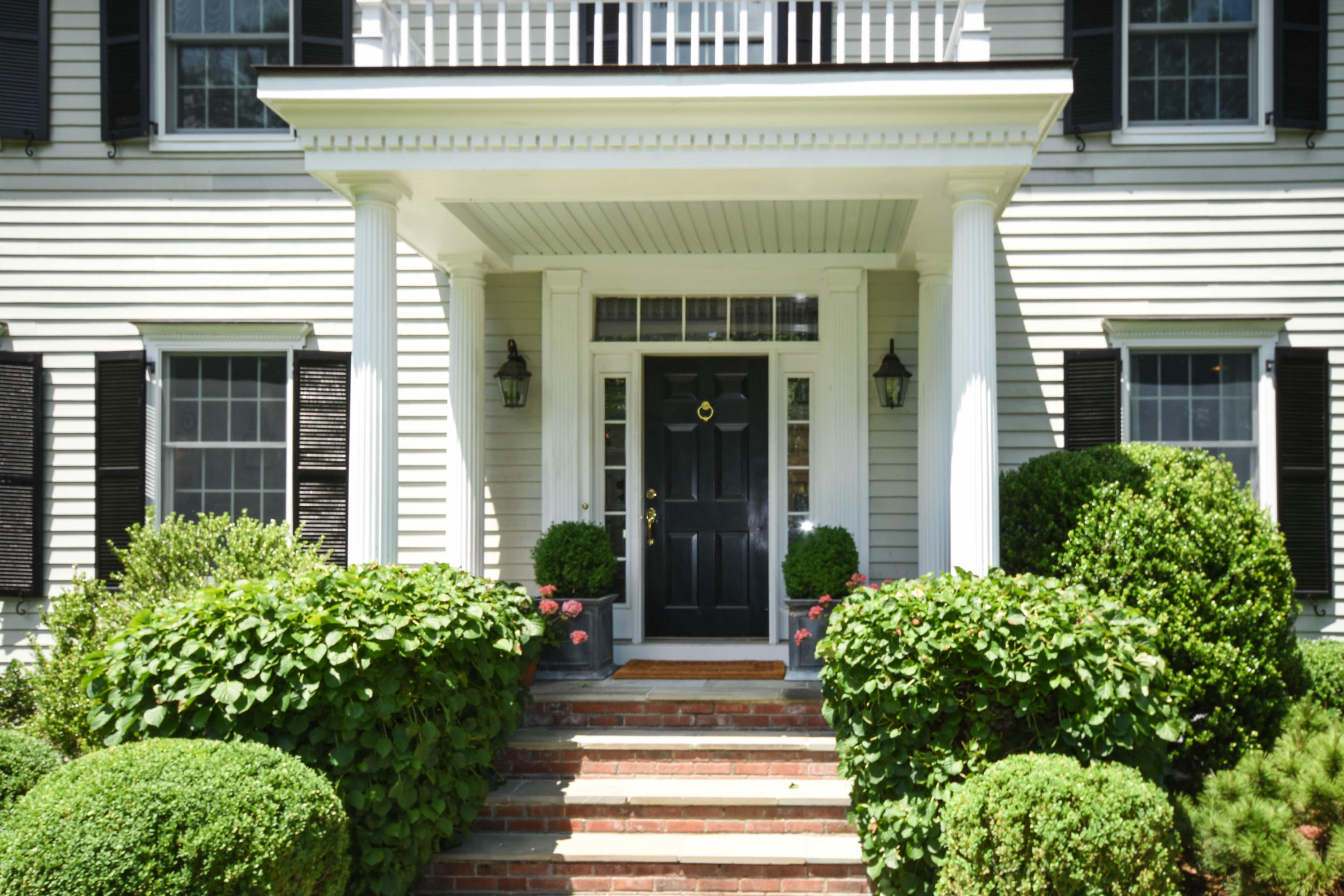 104 Jonathan Road New Canaan, CT 06840 - Photo 2 of 25 a front view of a house with plants