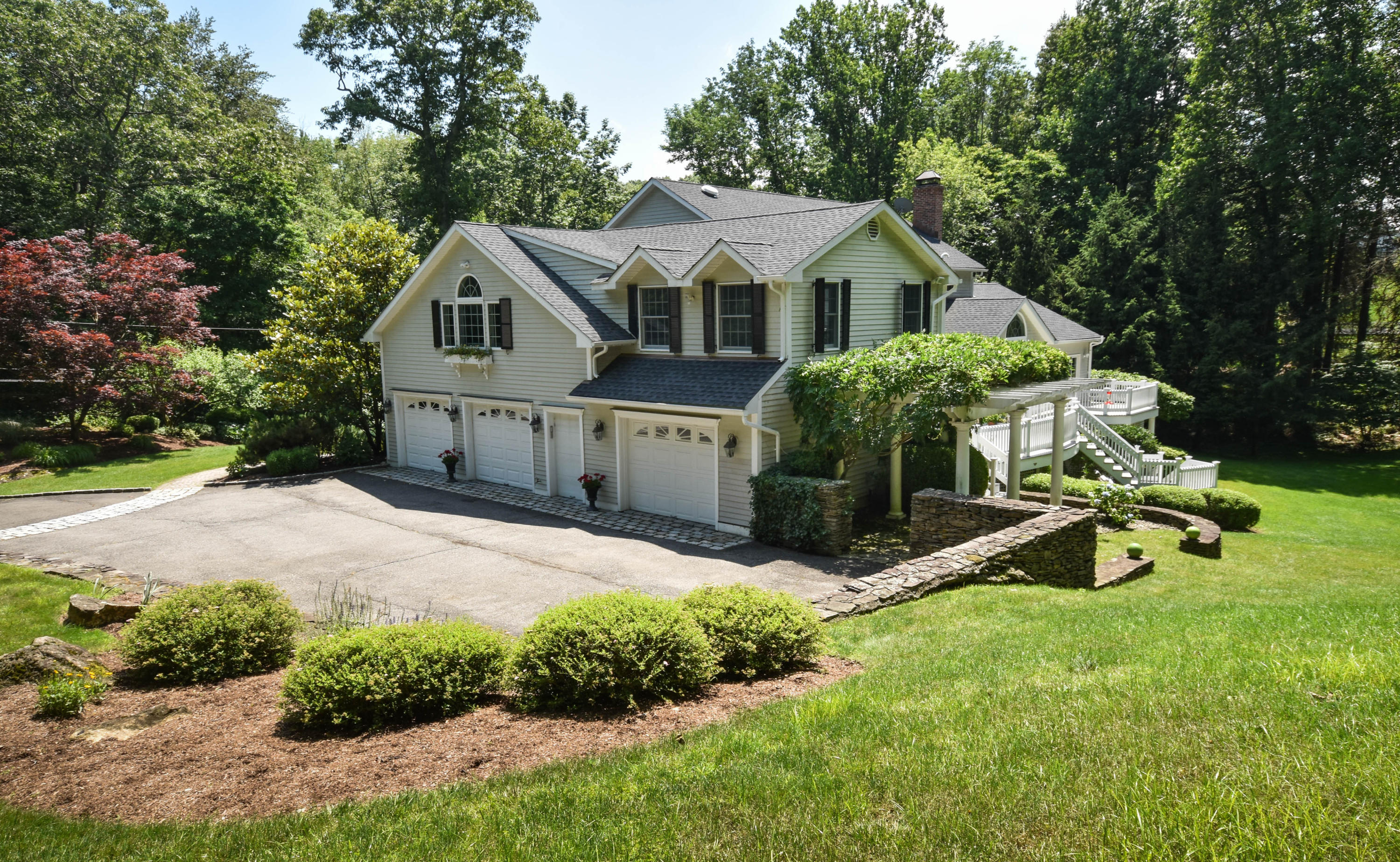 104 Jonathan Road New Canaan, CT 06840 - Photo 21 of 25 a view of a house with backyard and sitting area