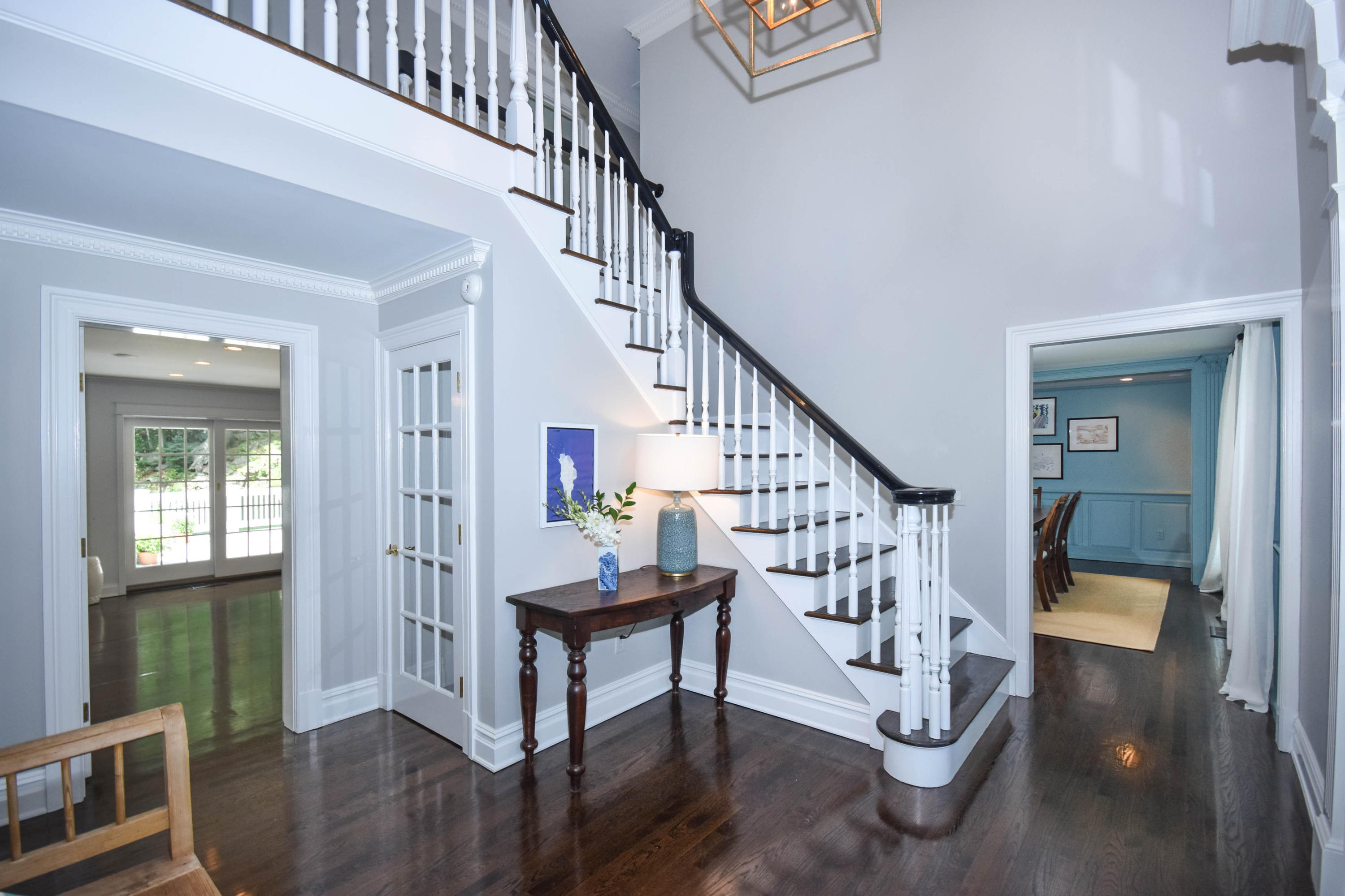 104 Jonathan Road New Canaan, CT 06840 - Photo 3 of 25 a view of entryway with wooden floor and stairs