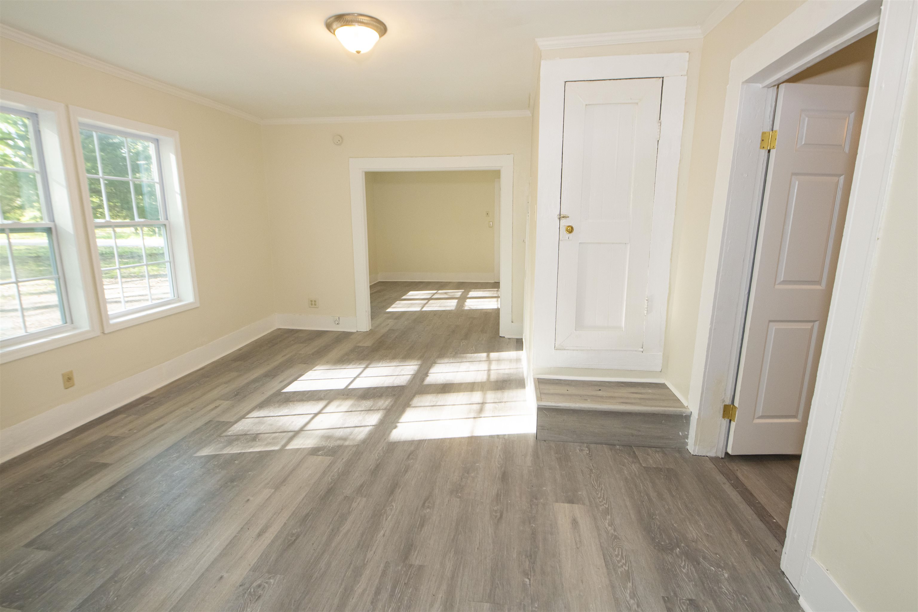 899 Craft Road Memphis, TN 38116 - Photo 2 of 13 Spare room with ornamental molding, baseboards, and wood finished floors