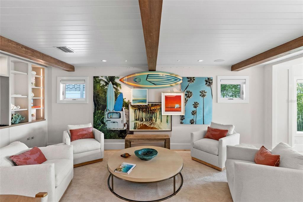 2807 Sunset Way St. Pete Beach, FL 33706 - Photo 12 of 49 a living room with furniture and a large window