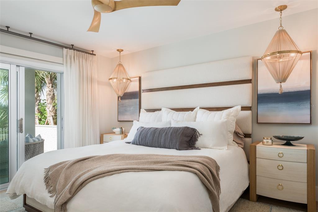 2807 Sunset Way St. Pete Beach, FL 33706 - Photo 18 of 49 a bedroom with a bed and a window