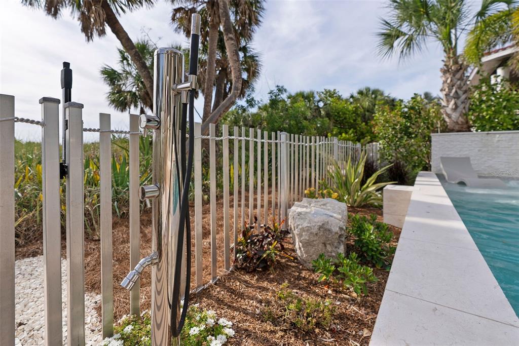 2807 Sunset Way St. Pete Beach, FL 33706 - Photo 41 of 49 a view of a garden with a fountain