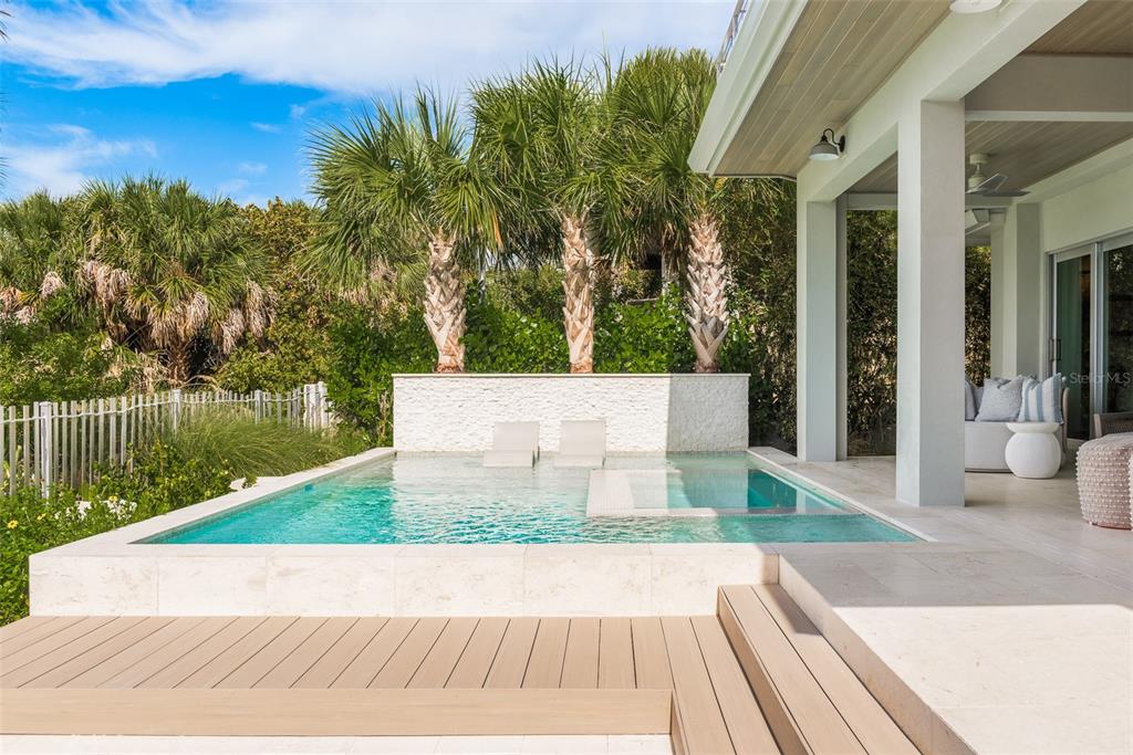 2807 Sunset Way St. Pete Beach, FL 33706 - Photo 43 of 49 a view of a backyard of a house