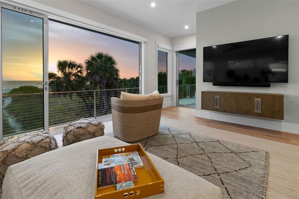 2807 Sunset Way St. Pete Beach, FL 33706 - Photo 46 of 49 a living room with furniture and a flat screen tv