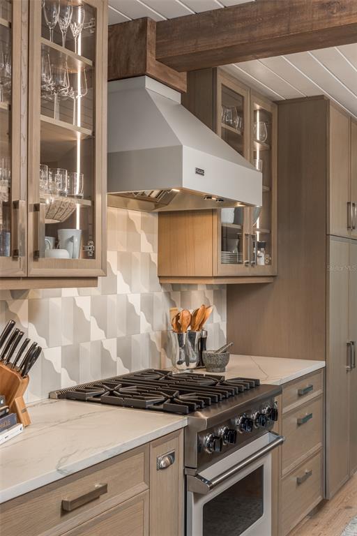 2807 Sunset Way St. Pete Beach, FL 33706 - Photo 9 of 49 a stove top oven sitting inside of a kitchen