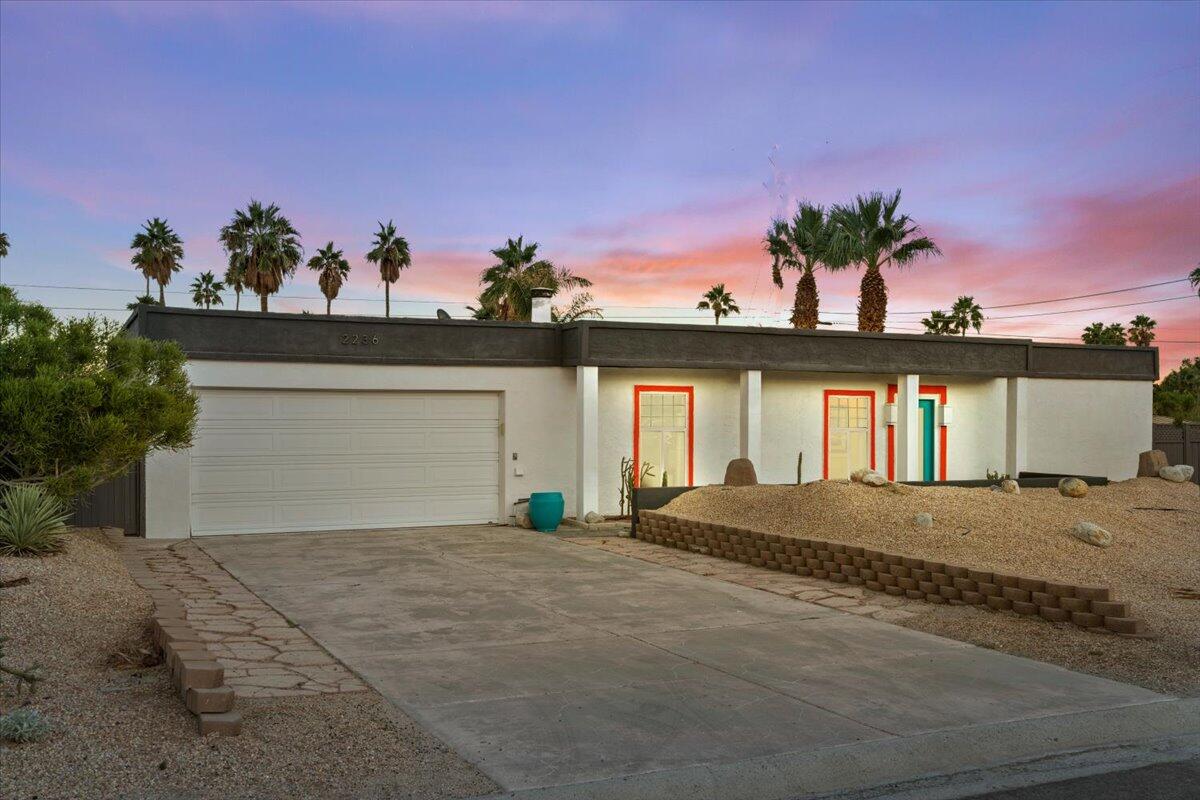 2236 North Victoria Road Palm Springs, CA 92262 - Photo 1 of 40 a view of a house with a yard and potted plants