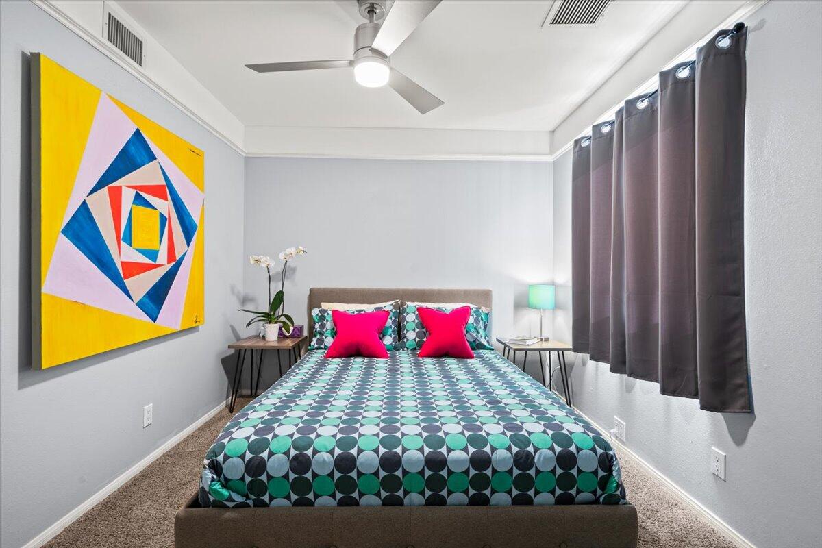2236 North Victoria Road Palm Springs, CA 92262 - Photo 21 of 40 a bed room with a bed and a painting on the wall
