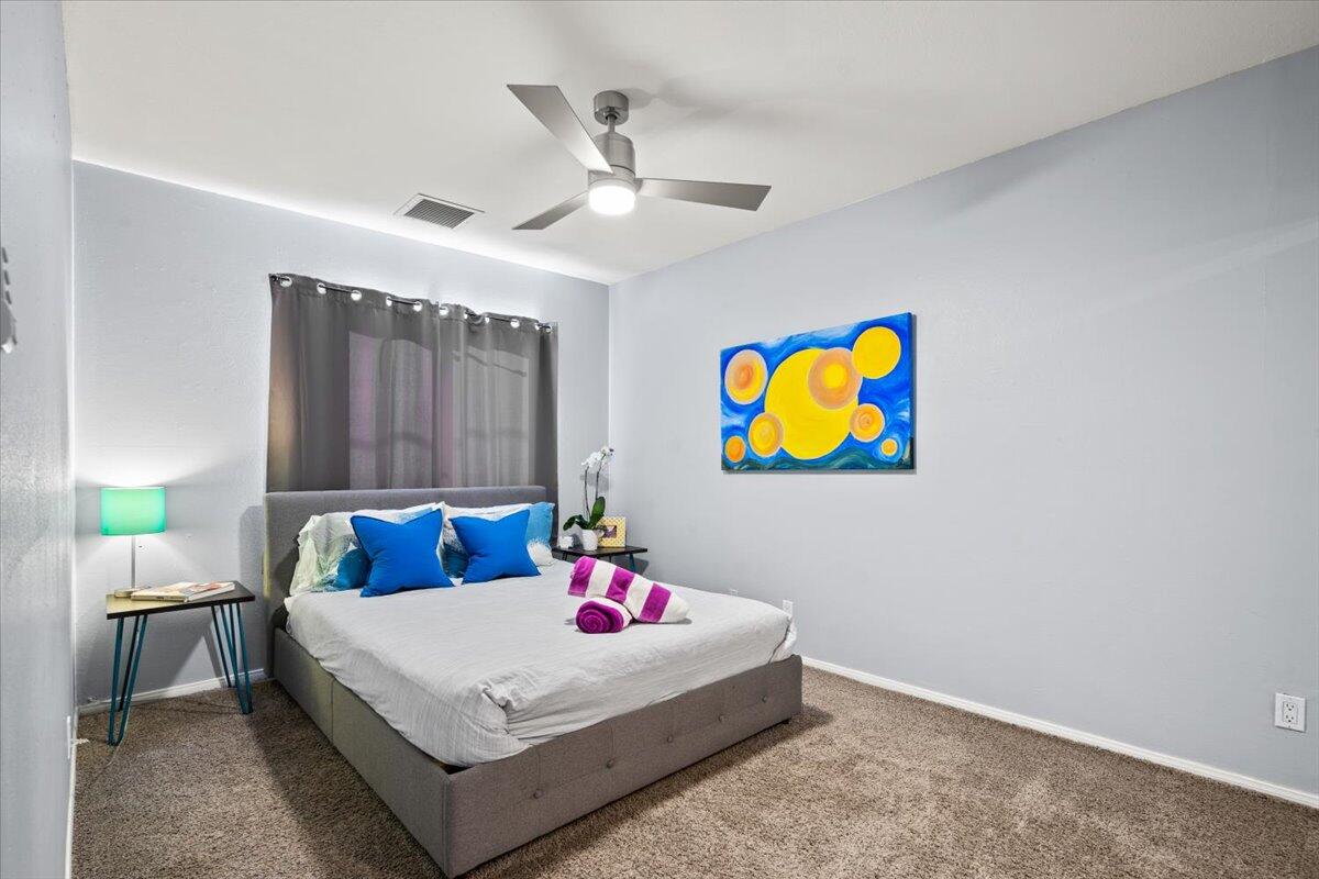 2236 North Victoria Road Palm Springs, CA 92262 - Photo 24 of 40 a bedroom with a bed and ceiling fan
