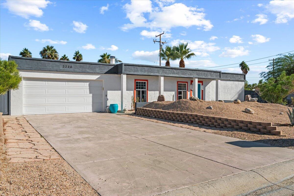 2236 North Victoria Road Palm Springs, CA 92262 - Photo 26 of 40 a front view of a house with a yard