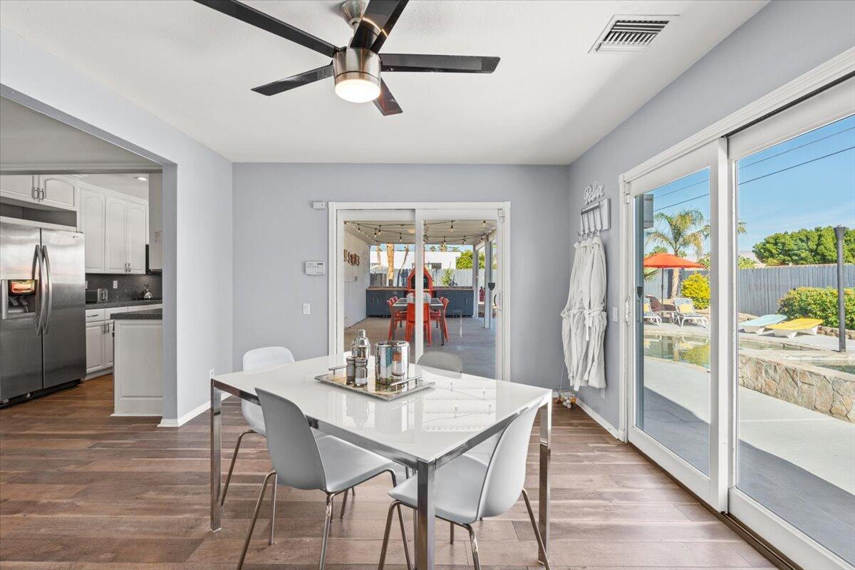 2236 North Victoria Road Palm Springs, CA 92262 - Photo 10 of 40 a dining room with furniture a window and wooden floor