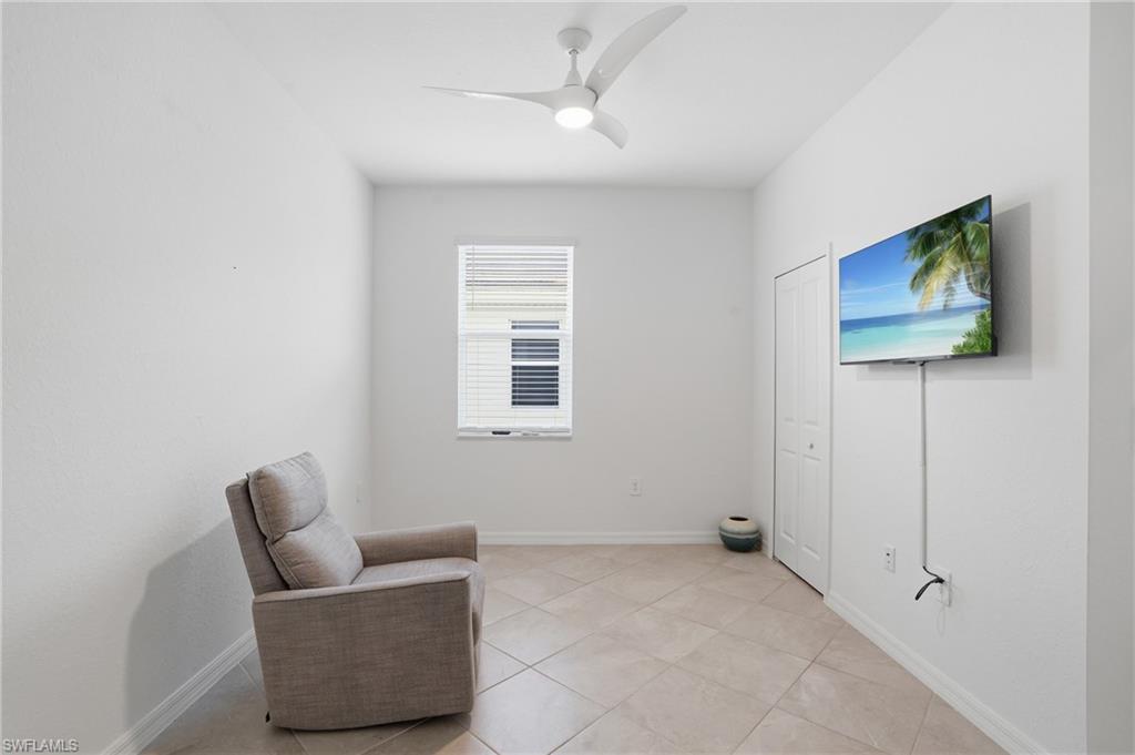 2215 Dragonfruit Way Naples, FL 34120 - Photo 19 of 38 a living room with furniture and a window