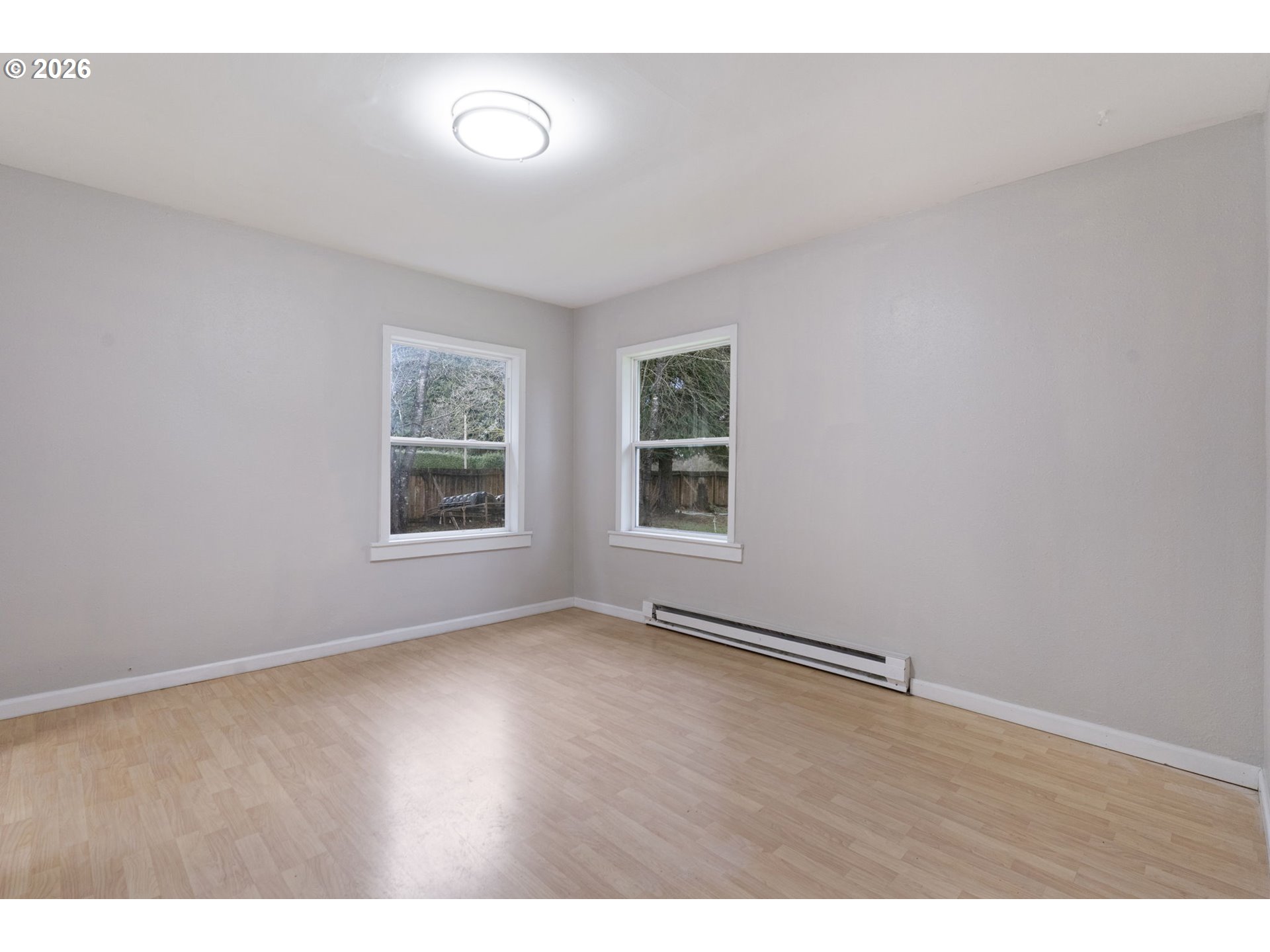 25106 Northeast 25th Street Camas, WA 98607 - Photo 16 of 47 an empty room with wooden floor and windows