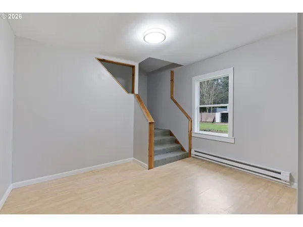 a view of an empty room with stairs