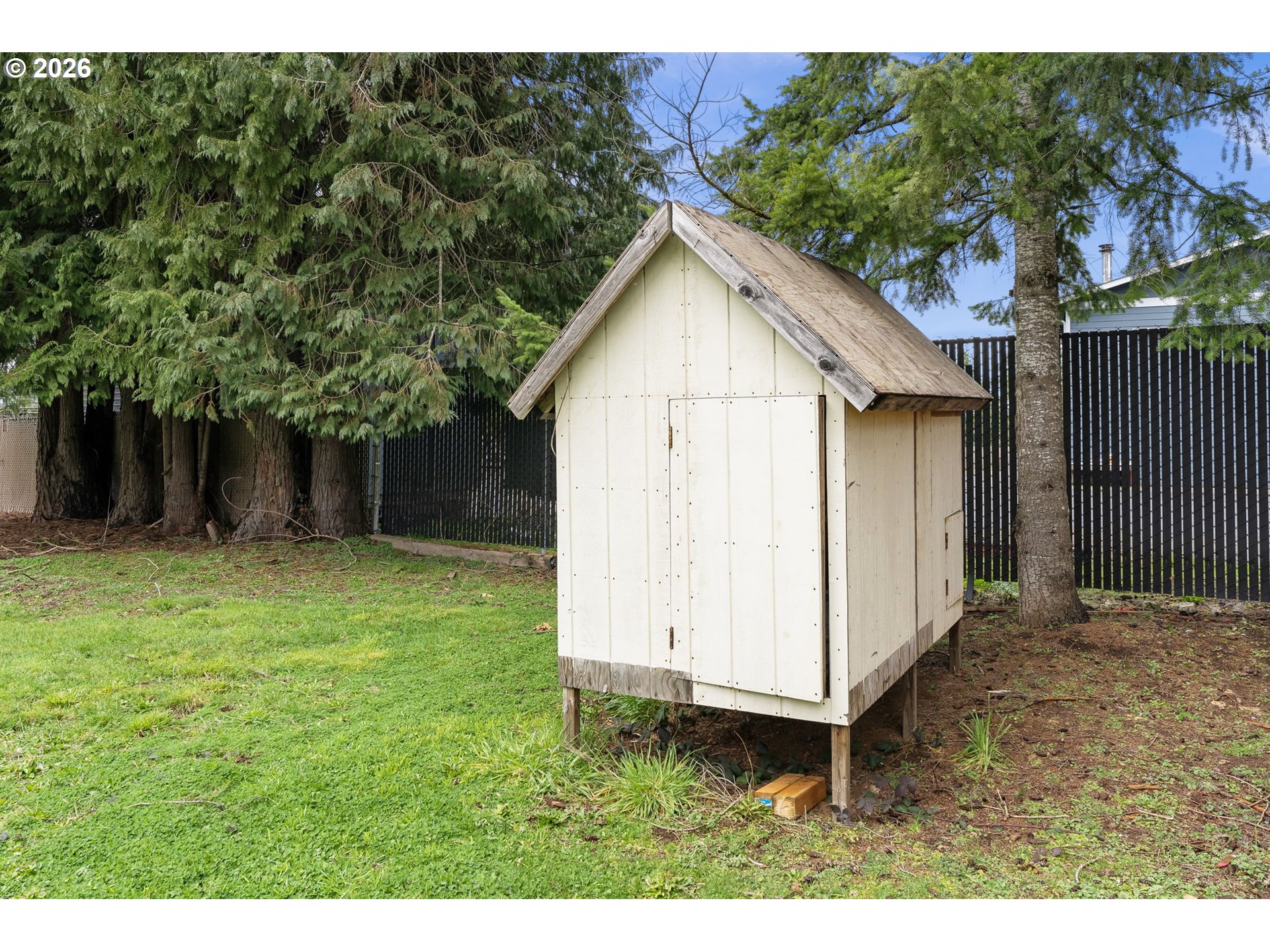 25106 Northeast 25th Street Camas, WA 98607 - Photo 33 of 47 a view of a backyard with barn and wooden fence