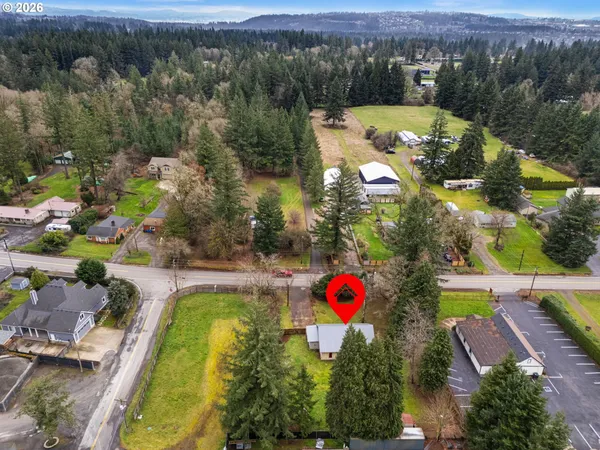 an aerial view of a house with a swimming pool yard and mountain view
