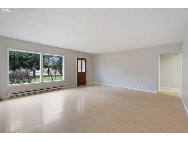 a view of an empty room with a window