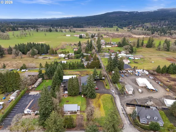 an aerial view of residential building and lake