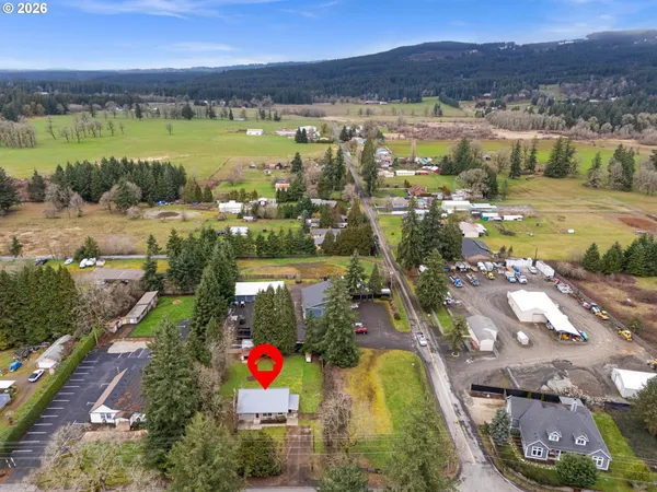 an aerial view of residential building and lake