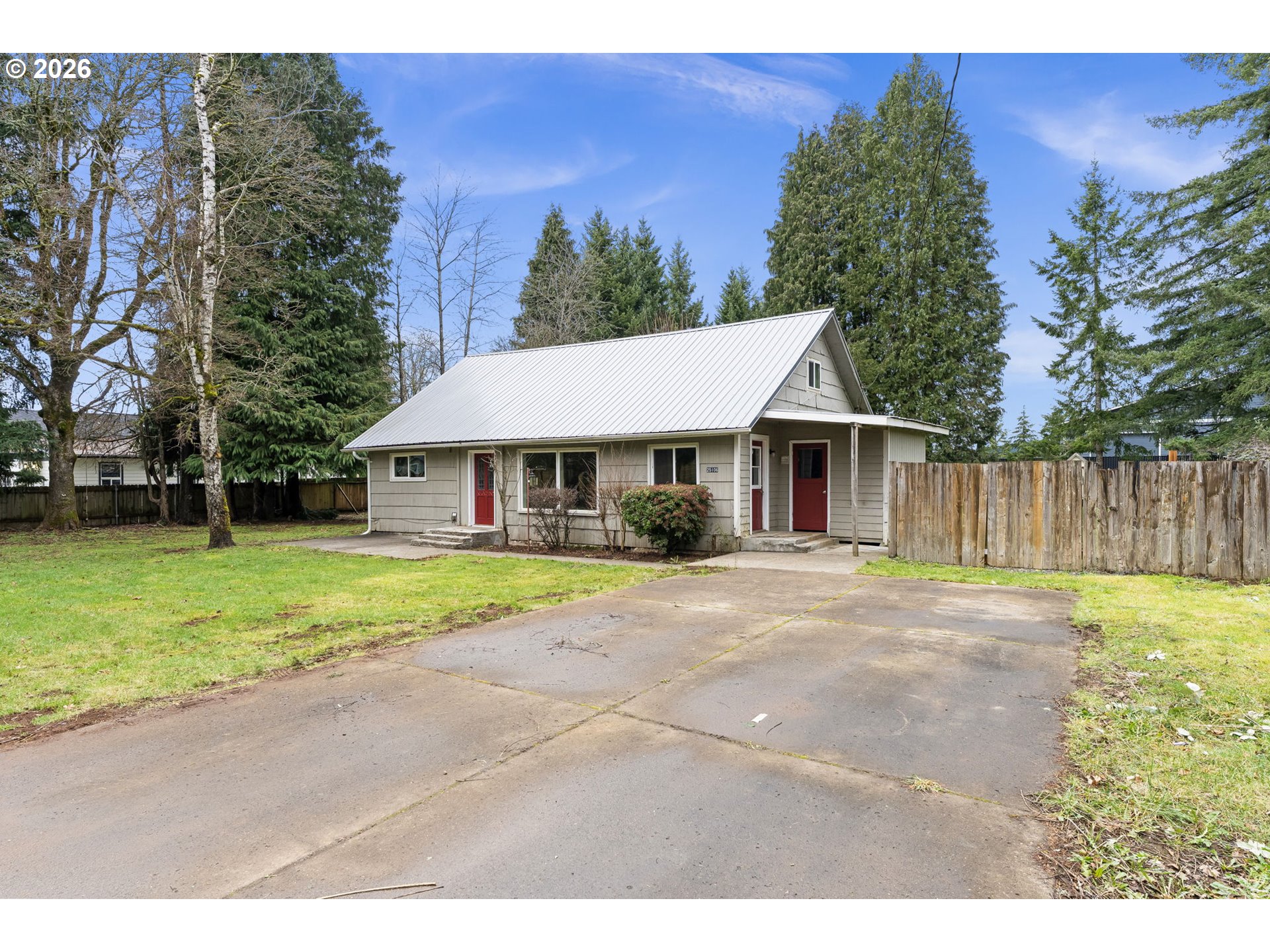 25106 Northeast 25th Street Camas, WA 98607 - Photo 45 of 47 a front view of a house with a yard and trees