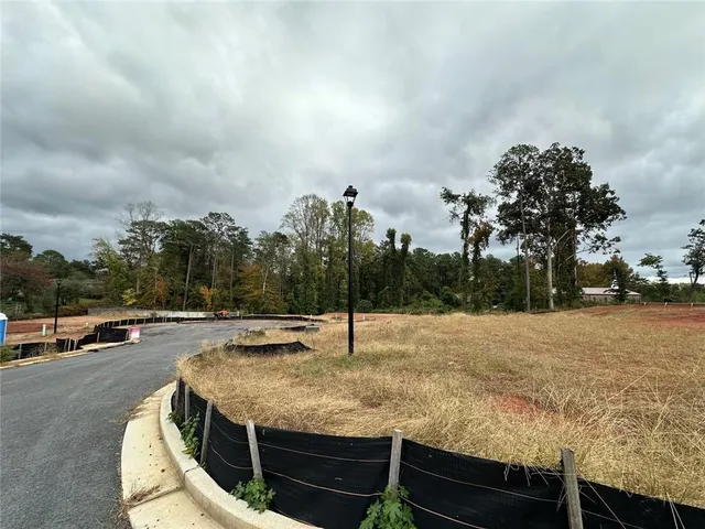 a swimming pool with some trees in the background