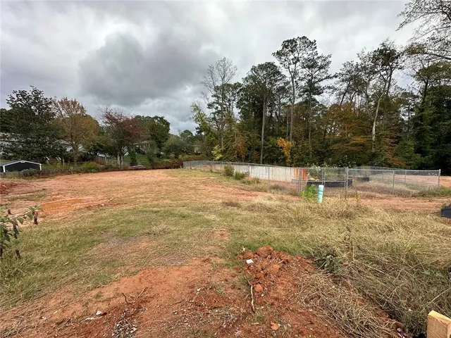 a view of a yard with wooden floor