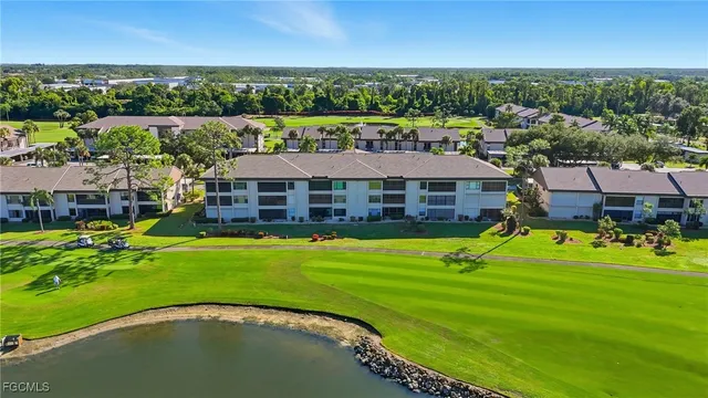 an aerial view of residential houses and outdoor space