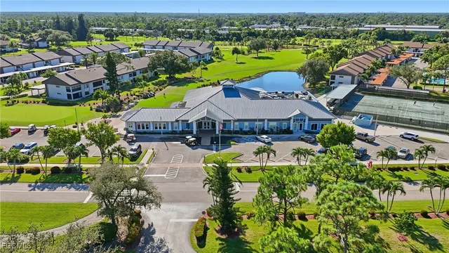an aerial view of a house with a lake view