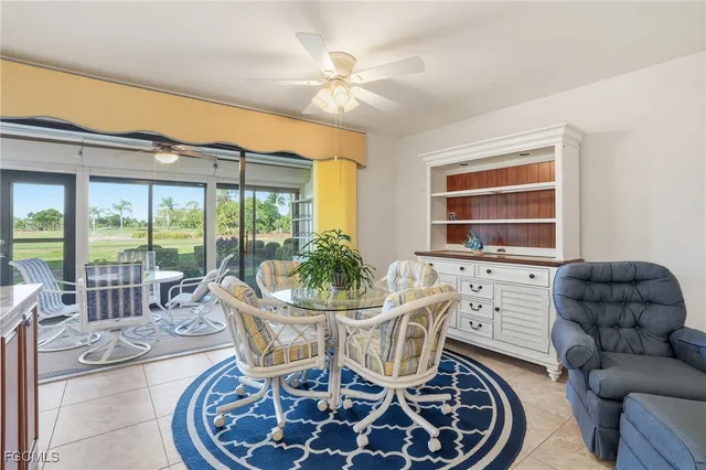 a dining room with furniture mountain view and a chandelier