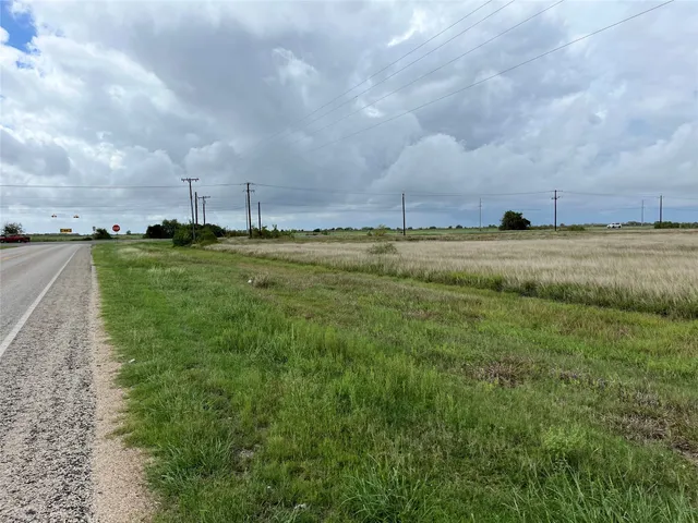 a view of lake with houses in the back