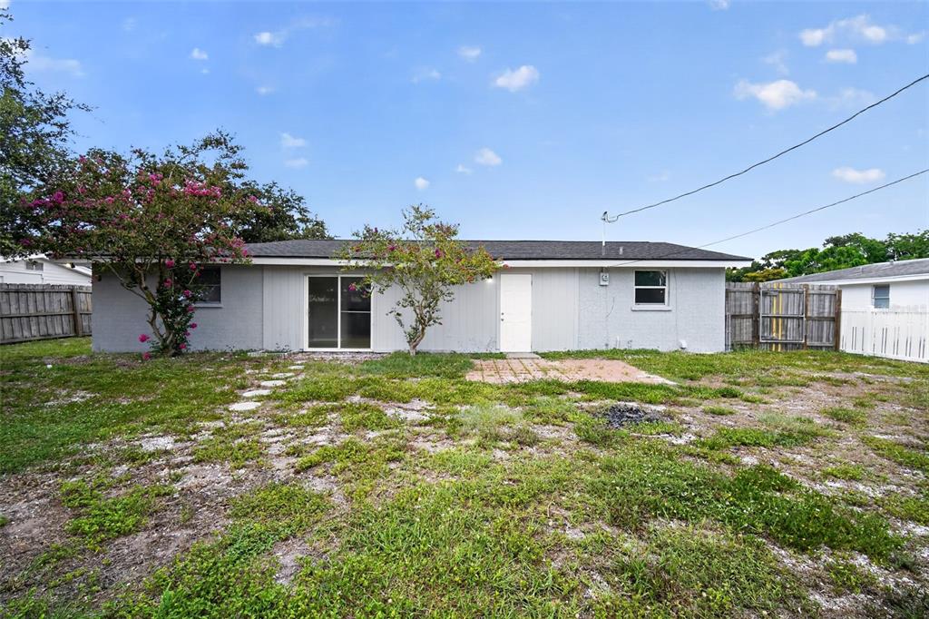3834 Warren Ridge Street Sarasota, FL 34233 - Photo 28 of 31 a view of a house with a backyard